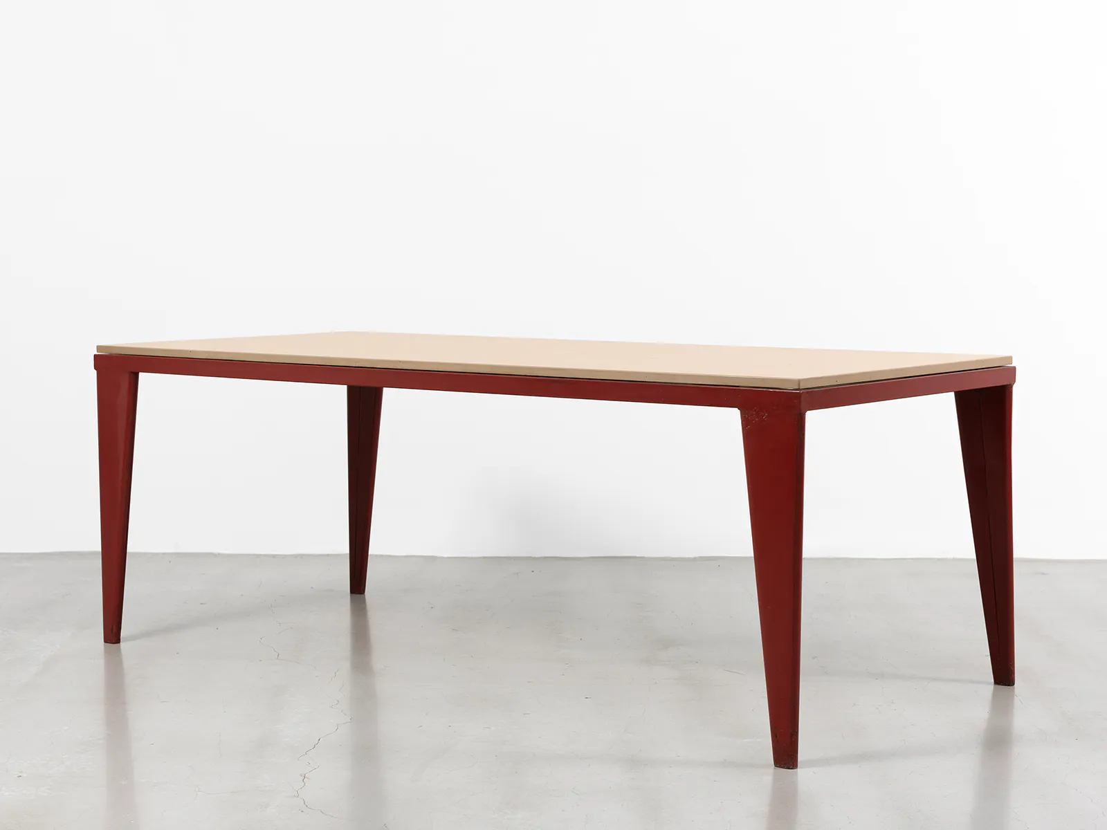 JEAN PROUVÉ - S.A.M. table, ca. 1939 JEAN PROUVÉ - S.A.M. table, ca. 1939 – Red lacquered bent sheet steel and Comblanche limestone